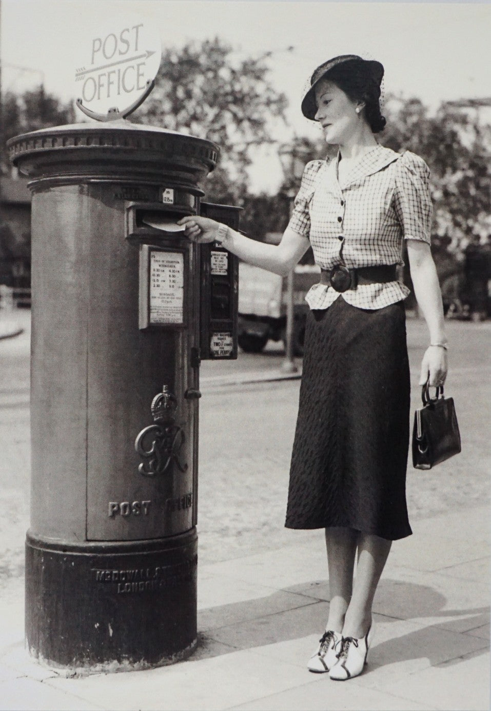 A lady Posts a Letter Card