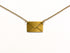 Gold envelope pendant on a chain against a white background