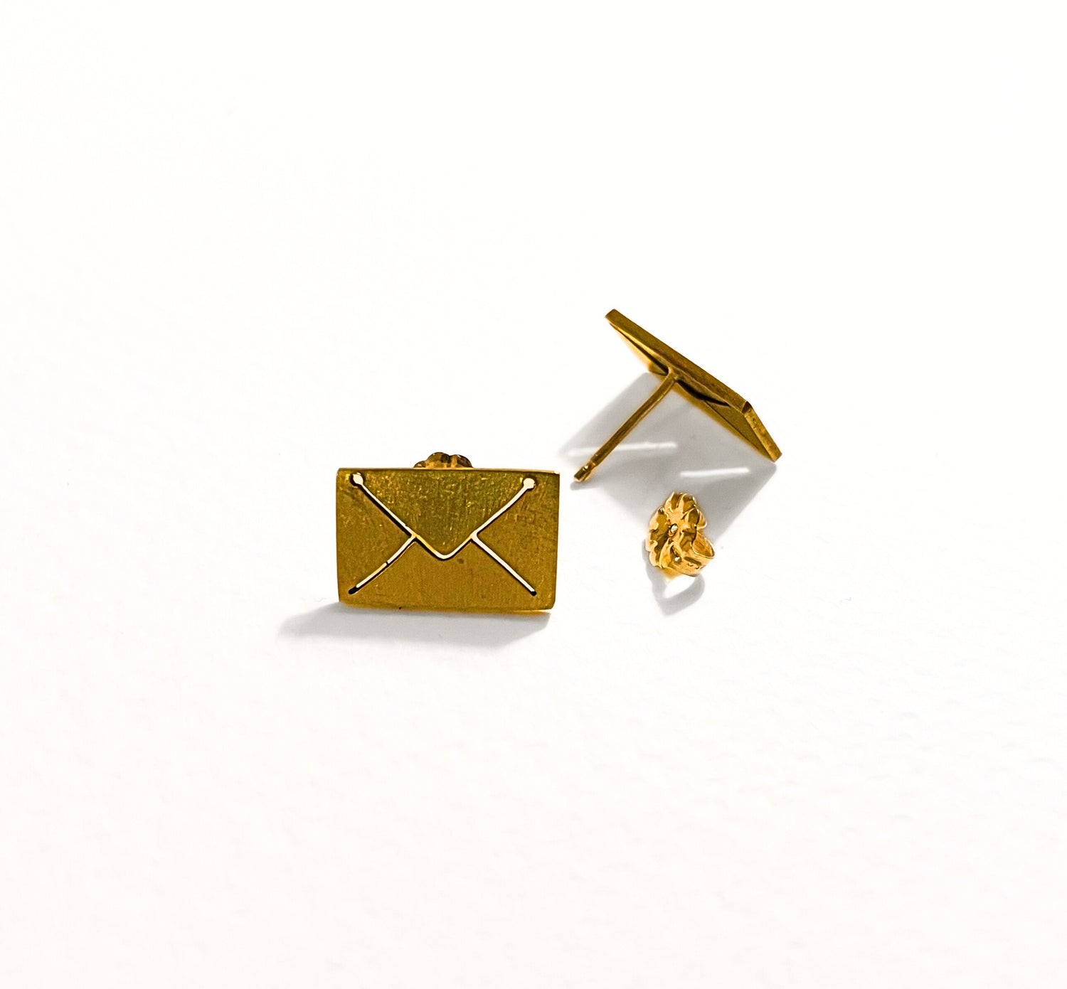 Stud earrings on white background 