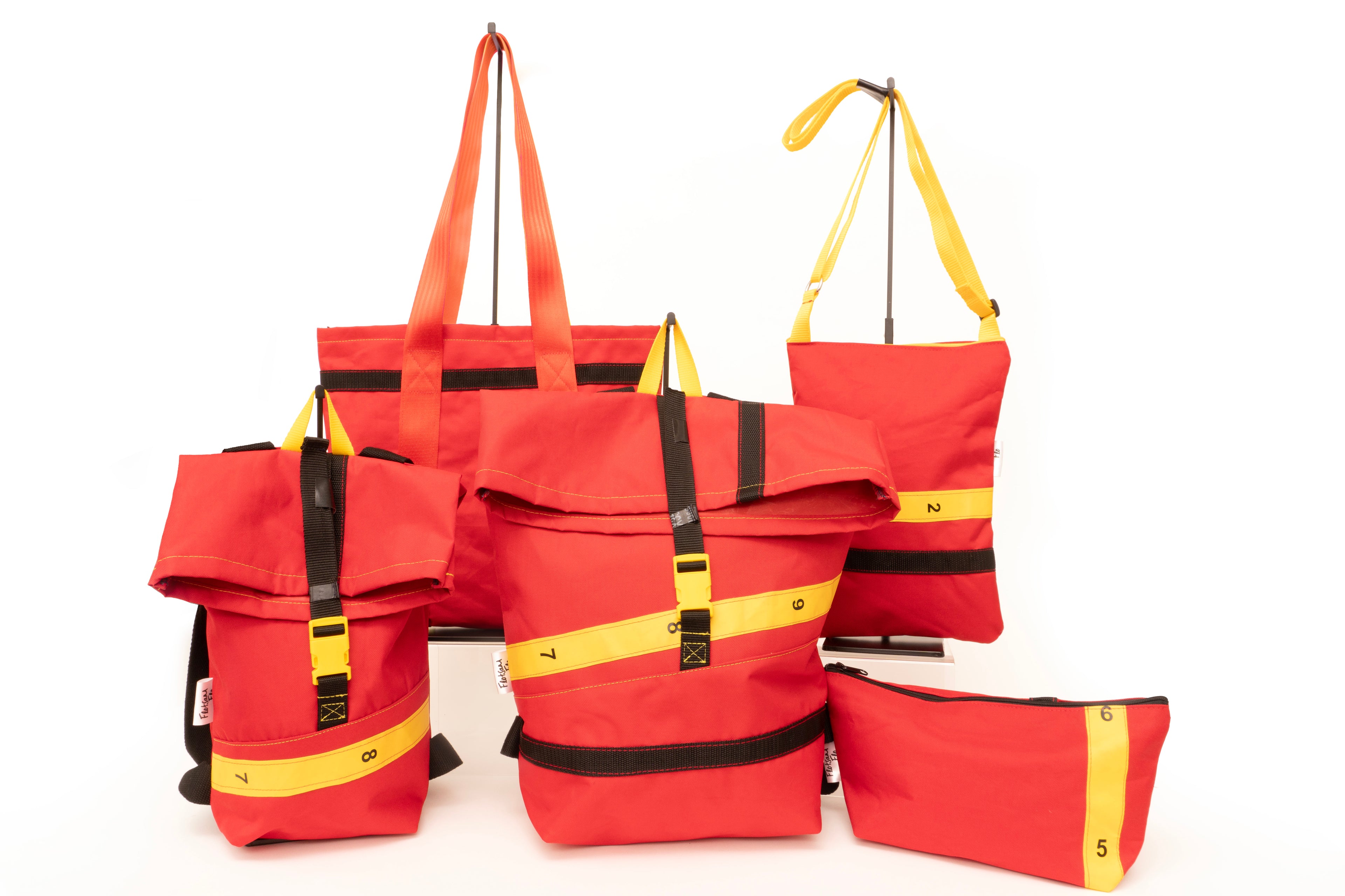 Image displaying the full collection of Flotsam Flo bags upcycled from Royal Mail trolley sleeves 