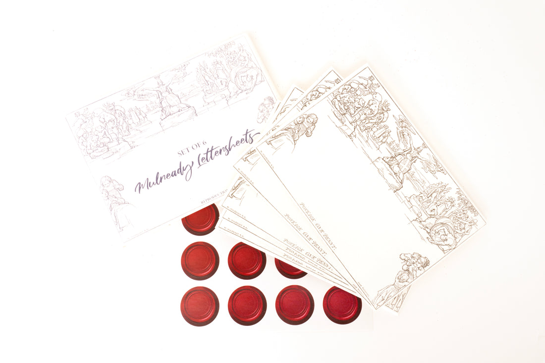 Replicas of the Mulready postal stationery letter sheets by artist William Mulready. Image shows blank sheets and wax stamp style stickers. Set contents view