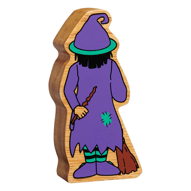 Wooden toy figure of a witch with a purple outfit and broomstick on a white background