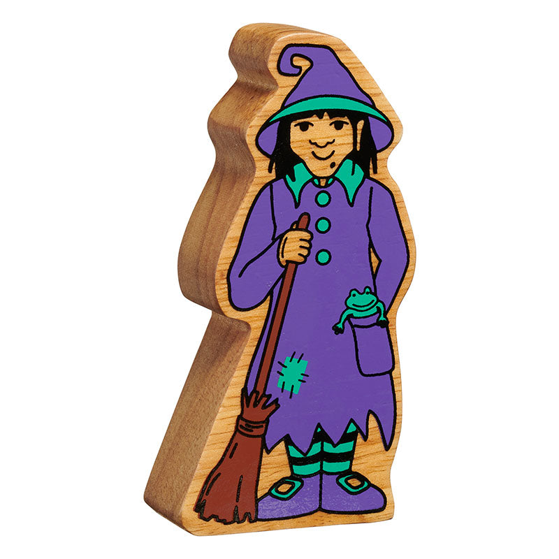 Wooden toy figure of a witch with a broomstick on a white background