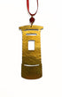 Gold ornament shaped like a traditional Post Box on a white background